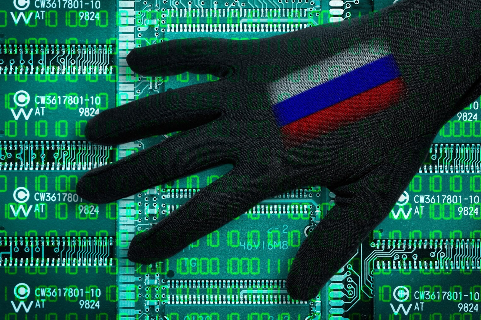 Black hand with Russia flag about computer boards, symbolic photo Cyberattacken, Schwarze Hand mit Russland-Fahne ueber Computerplatinen, Symbolfoto Cyberattacken,Image: 327852934, License: Rights-managed, Restrictions: , Model Release: no, Credit line: Bildagentur-online/O hde / Alamy / Alamy / Profimedia