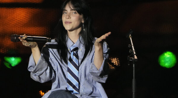 Billie Eilish performs during the Power Our Planet concert on the sideline of the Climate Finance conference in Paris, Thursday, June 22, 2023. World leaders, heads of international organisations and activists are gathering in Paris for a two-day summit aimed at seeking better responses to tackle poverty and climate change issues by reshaping the global financial system. (AP Photo/Lewis Joly)