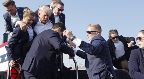 BUTLER, PENNSYLVANIA - JULY 13: Republican presidential candidate former President Donald Trump is rushed offstage during a rally on July 13, 2024 in Butler, Pennsylvania.   Anna Moneymaker,Image: 889546893, License: Rights-managed, Restrictions: , Model Release: no, Credit line: Anna Moneymaker / Getty images / Profimedia