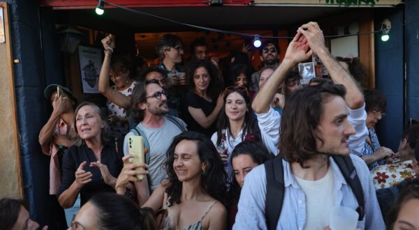 epa11465676 French people react after the second round of the legislative elections results in Marseille, Southern France, 07 July 2024.  France voted on 07 July for the second round of the legislative elections. According to the first official results, the leftist alliance Le Nouveau Front Populaire came ahead of the French President Macron party and the extreme right one the  Rassemblement national (RN).  EPA/TERESA SUAREZ