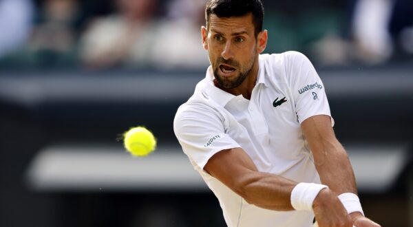 epa11474584 Novak Djokovic of Serbia in action during the Men's semifinal match against Lorenzo Musetti of Italy at the Wimbledon Championships, Wimbledon, Britain, 12 July 2024.  EPA/TOLGA AKMEN  EDITORIAL USE ONLY