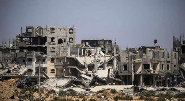 epa11506093 Destroyed structures as Palestinians flee from Al Bureije refugee camp after a new evacuation order was issued by the Israel Defense Forces (IDF) for Al Bureije and Al Nusairat camps in the central Gaza Strip, 29 July 2024. More than 39,000 Palestinians and over 1,400 Israelis have been killed, according to the Palestinian Health Ministry and the Israel Defense Forces (IDF), since Hamas militants launched an attack against Israel from the Gaza Strip on 07 October 2023, and the Israeli operations in Gaza and the West Bank which followed it.  EPA/MOHAMMED SABER