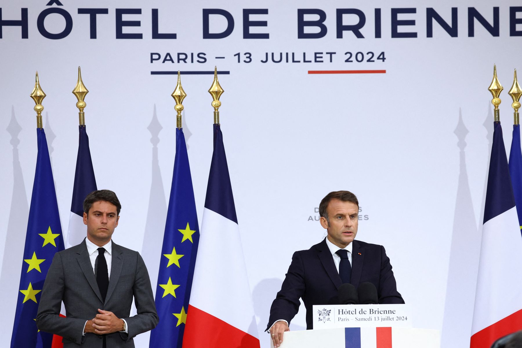 epa11476406 French President Emmanuel Macron (R), accompanied by French Prime Minister Gabriel Attal, gives a speech to the French Military Forces at the Hotel de Brienne in Paris, France, 13 July 2024, on the eve of Bastille Day, the French national day.  EPA/STEPHANIE LECOCQ / POOL MAXPPP OUT