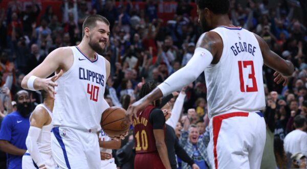 LOS ANGELES, CALIFORNIA - APRIL 07: Ivica Zubac #40 and Paul George #13 of the LA Clippers celebrate a 120-1118 win over the Cleveland Cavaliers at Crypto.com Arena on April 07, 2024 in Los Angeles, California. User is consenting to the terms and conditions of the Getty Images License Agreement.   Harry How,Image: 864073074, License: Rights-managed, Restrictions: , Model Release: no, Credit line: Harry How / Getty images / Profimedia