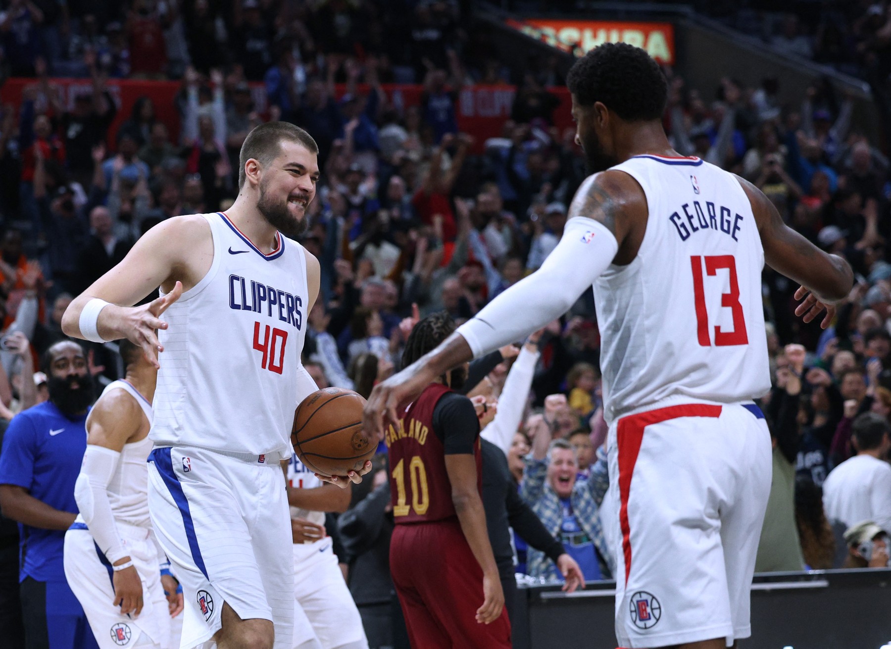 LOS ANGELES, CALIFORNIA - APRIL 07: Ivica Zubac #40 and Paul George #13 of the LA Clippers celebrate a 120-1118 win over the Cleveland Cavaliers at Crypto.com Arena on April 07, 2024 in Los Angeles, California. User is consenting to the terms and conditions of the Getty Images License Agreement.   Harry How,Image: 864073074, License: Rights-managed, Restrictions: , Model Release: no, Credit line: Harry How / Getty images / Profimedia