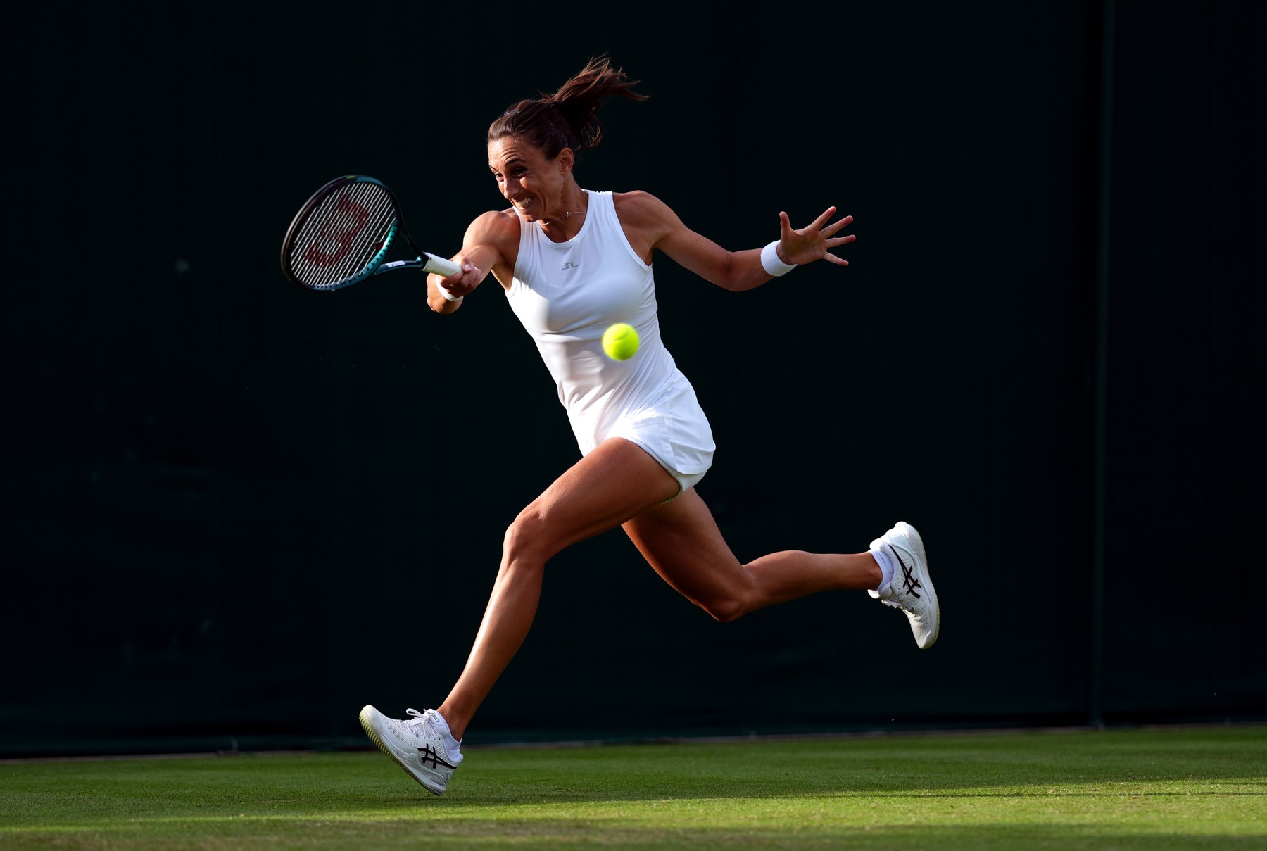 Petra Martic in action against Francesca Jones (not pictured) on day two of the 2024 Wimbledon Championships at the All England Lawn Tennis and Croquet Club, London. Picture date: Tuesday July 2, 2024.,Image: 886707622, License: Rights-managed, Restrictions: Editorial use only. No commercial use without prior written consent of the AELTC. Still image use only - no moving images to emulate broadcast. No superimposing or removal of sponsor/ad logos., Model Release: no, Credit line: John Walton / PA Images / Profimedia