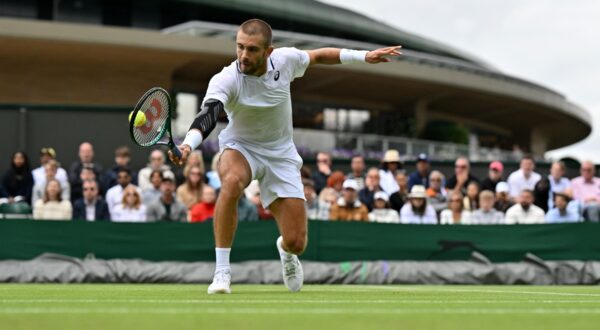 Croatia's Borna Coric returns against US player Frances Tiafoe during their men's singles second round tennis match on the third day of the 2024 Wimbledon Championships at The All England Lawn Tennis and Croquet Club in Wimbledon, southwest London, on July 3, 2024.,Image: 886957428, License: Rights-managed, Restrictions: RESTRICTED TO EDITORIAL USE, Model Release: no, Credit line: Glyn KIRK / AFP / Profimedia