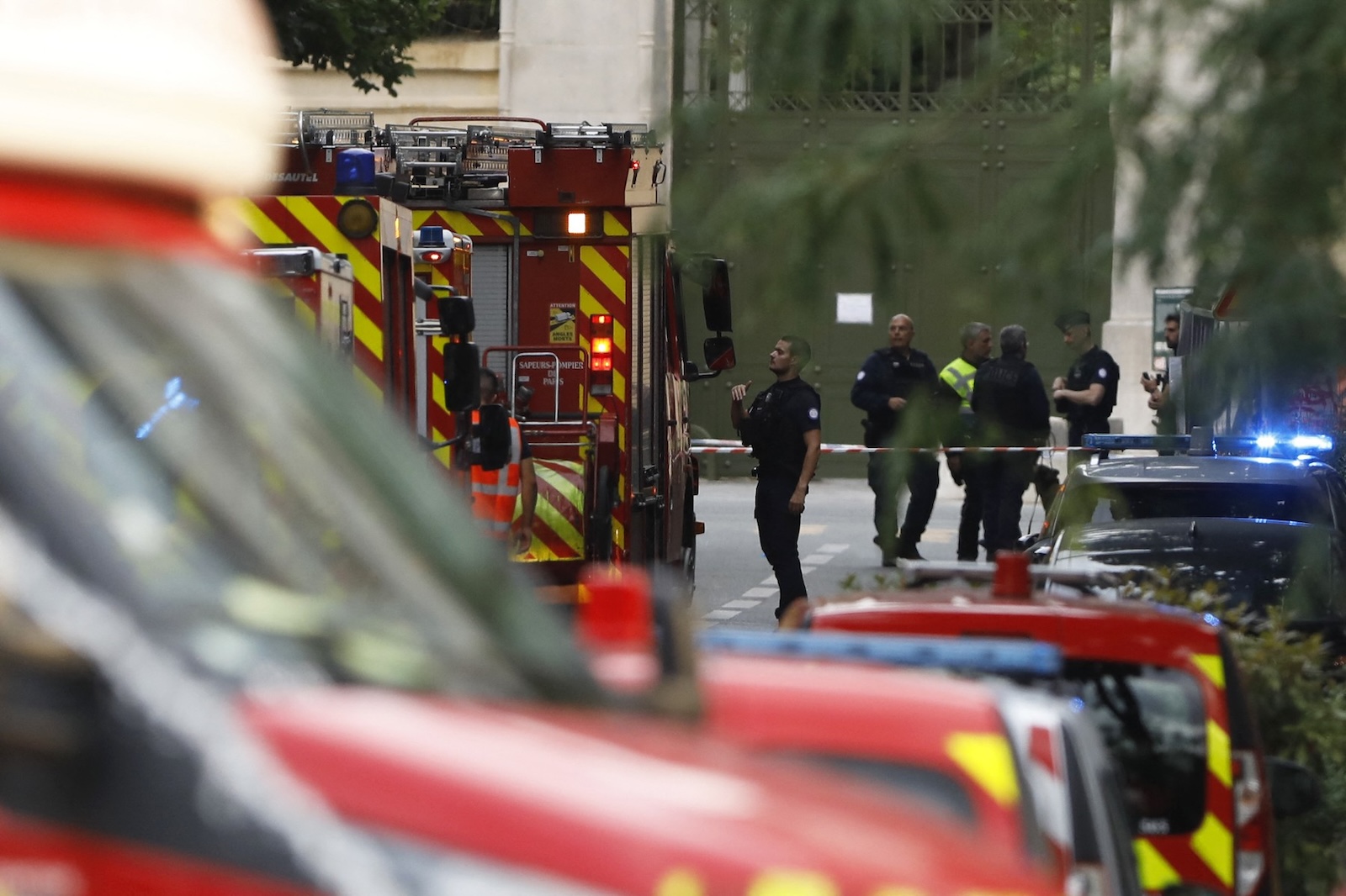 Police officers stand next to rescue vehicles near the bar "Le Ramus" (unseen) where a motorist drove onto the terrace of a cafe, leaving several injured, in Paris on July 17, 2024. A police source who asked not to be named said the driver fled the scene in northern Paris while a passenger from the vehicle was detained. A separate source close to the enquiry said the passenger tested positive for drug and alcohol consumption.,Image: 890389329, License: Rights-managed, Restrictions: , Model Release: no, Credit line: IAN LANGSDON / AFP / Profimedia