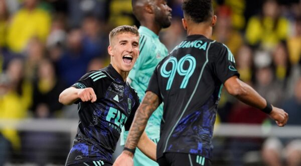 Los Angeles FC forward Stipe Biuk, centre, congratulates forward Denis Bouanga right, after his goal against the Nashville SC during the second half of an MLS 