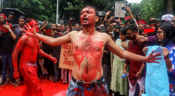epaselect epa11519012 Bangladeshi artists perform during a mass demonstration in Dhaka, Bangladesh, 02 August 2024. Thousands of people took part in a nationwide prayer and student procession to protest the "massacre and mass arrests" following recent protests by the Quota Reform Movement, which is demanding reforms to the government's job quota system. Authorities in Bangladesh have announced a gradual easing of a curfew imposed on July 20 after violence erupted in Dhaka and other regions following mass protests last week, allowing offices to open and some activities to take place, and partially restoring telecommunications services.  EPA/MONIRUL ALAM
