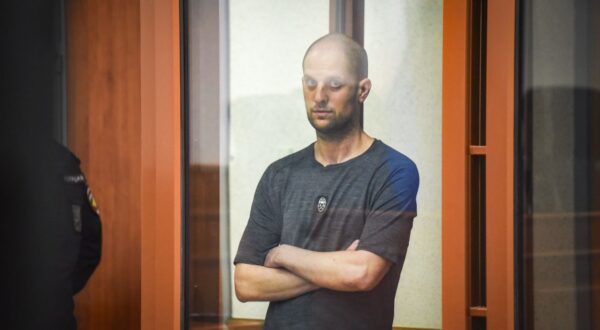epa11487536 The Wall Street Journal (WSJ) correspondent Evan Gershkovich stands inside a glass defendant's cage during verdict announcement in the case against him, in Yekaterinburg's Sverdlovsk Regional Court, Russia, 19 July 2024. Evan Gershkovich, a US journalist of The Wall Street Journal covering Russia, was detained in Yekaterinburg on 29 March 2023. The Russian Federal Security Service (FSB) claimed that on the instructions of the American authorities, the journalist collected information constituting a state secret about one of the enterprises of the Russian military-industrial complex. Yekaterinburg's Sverdlovsk Regional Court sentenced Evan Gershkovich to 16 years in prison.  EPA/STRINGER