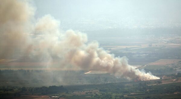 epa11509218 Smoke rises as a result of a missile fired from south Lebanon, in Keppotz HaGoshrim in the Upper Galilee, northern Israel, 30 July 2024. The Israeli army reported that approximately 10 projectiles crossed from Lebanon into Israeli territory, the majority were intercepted. A hit was identified in the area of HaGoshrim in northern Israel. Reports were received regarding a civilian that was injured as a result of the attack.  EPA/ATEF SAFADI