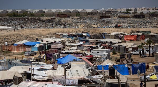 epa11515459 Displaced Palestinians set up their tents next to sewage and a garbage dump on a street in Khan Younis camp in the southern Gaza Strip, 01 August 2024. Since 07 October 2023, up to 1.7 million people, or more than 75 percent of the population, have been displaced throughout the Gaza Strip, some more than once, in search of safety, according to the United Nations Relief and Works Agency for Palestine Refugees in the Near East (UNRWA), which added that the Palestinian enclave is 'on the brink of famine', with 1.1 million people (half of its population) 'experiencing catastrophic food insecurity' due to the conflict and restrictions on humanitarian access.  EPA/HAITHAM IMAD