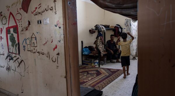 epa11549011 Palestinians inside the Asdaa Central Prison facility, which has been converted into a shelter for internally displaced people, in Khan Younis, southern Gaza Strip, 14 August 2024. Since 07 October 2023, up to 1.7 million people, or more than 75 percent of the population, have been displaced throughout the Gaza Strip, some more than once, in search of safety, according to the United Nations Relief and Works Agency for Palestine Refugees in the Near East (UNRWA), which added that the Palestinian enclave is 'on the brink of famine', with 1.1 million people (half of its population) 'experiencing catastrophic food insecurity' due to the conflict and restrictions on humanitarian access.  EPA/HAITHAM IMAD