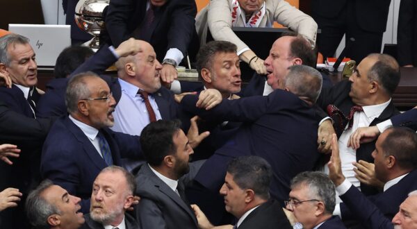 Turkish ruling and opposition lawmakers fight each other after a scuffle between former footballer Alpay Ozalan (unseen), a lawmaker from Erdogan's ruling AKP party and Turksih Workers Party (TIP) deputy Ahmet Sik (unseen) at Grand National Assembly of Turkey in Ankara on August 16,2024. A brawl broke out in Turkey's parliament on August 16, 2024, after lawmakers convened to discuss the status of a jailed opposition figure controversially stripped of his parliamentary immunity earlier this year. They were meeting after the country's constitutional court earlier this month struck down parliament's decision to oust Can Atalay from his parliamentary seat.,Image: 899211133, License: Rights-managed, Restrictions: , Model Release: no, Credit line: Adem ALTAN / AFP / Profimedia