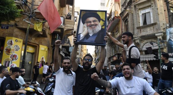 BEIRUT, LEBANON - SEPTEMBER 28: A group gather carrying Nasrallah's poster and chanting slogans following Hezbollah's statement after Hezbollah Secretary General Hassan Nasrallah was killed yesterday in Israeli airstrikes in Beirut, Lebanon on September 28, 2024. Houssam Shbaro / Anadolu,Image: 913191344, License: Rights-managed, Restrictions: , Model Release: no, Credit line: Houssam Shbaro / AFP / Profimedia