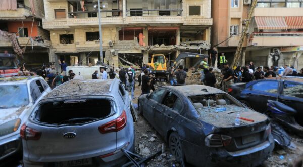 People gather at the scene of an Israeli strike that targeted Beirut's southern suburbs a day earlier, as search and rescue operations continue on September 21, 2024. Lebanon's Hezbollah said on September 21 that a second senior commander was among 16 fighters killed in an Israeli air strike on its Beirut stronghold the previous day, highlighting the scale of the blow to its military leadership.,Image: 910334949, License: Rights-managed, Restrictions: , Model Release: no, Credit line: AFP / AFP / Profimedia