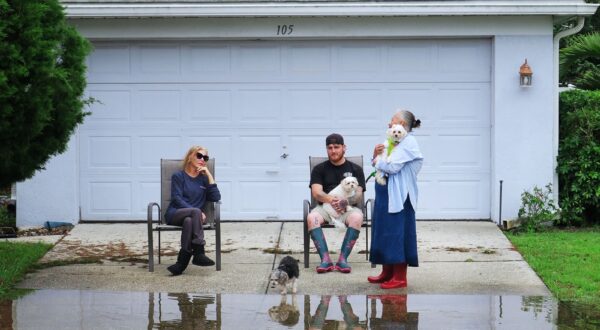 ALTAMONTE SPRINGS, FLORIDA, UNITED STATES - OCTOBER 10: Residents sit in their driveway on a street  that was flooded by rains from Hurricane Milton on October 10, 2024 in Altamonte Springs, Florida. Hurricane Milton passed through Central Florida after making landfall on Wednesday night on Floridaâ€™s Gulf coast as a Category 3 hurricane. The storm has caused massive destruction and flooding, spawned deadly tornadoes, and left millions without power. Paul Hennessy / Anadolu,Image: 919418748, License: Rights-managed, Restrictions: , Model Release: no, Credit line: Paul Hennessy / AFP / Profimedia