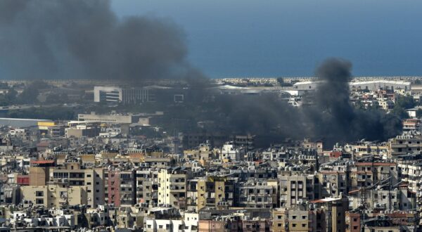 epa11643183 Smoke rises over residential buildings following an Israeli airstrike in the Hezbollah stronghold of Dahieh, a southern suburb of Beirut, Lebanon, 05 October 2024. Lebanese Minister of Health, Firas Abiad, announced on 04 October, that nearly 2,000 people have been killed and more than 9,300 others have been injured in Lebanon since the beginning of the Hezbollah-Israeli conflict.  EPA/WAEL HAMZEH