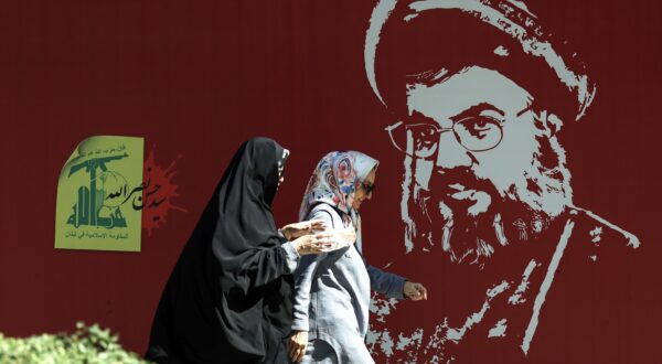 epa11647109 Iranian women walk past a portrait of late Hezbollah leader Hassan Nasrallah displayed in a street in Tehran, Iran, 07 October 2024. Tensions are growing between Iran and Israel following Iran's large-scale missile attack on Israel. Iran fired more than 180 ballistic missiles directed at Israel late on 01 October 2024, in 'retaliation for different assassinations' carried out by Israel and 'the crimes in Palestine and Lebanon', Islamic Revolutionary Guard Corps (IRGC) said. Israel's prime minister Benjamin Netanyahu said that Iran will pay for the 'big mistake'.  EPA/ABEDIN TAHERKENAREH