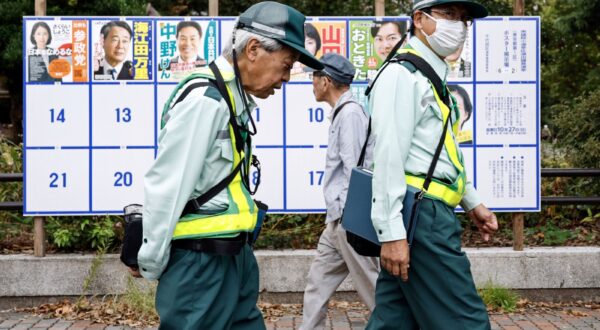 epa11682176 People pass by a board displaying campaign posters of candidates running for the upcoming general elections in Tokyo, Japan, 25 October 2024. Shortly after being elected as Japan’s Prime Minister, Ishiba Shigeru dissolved the parliament and called for elections of the House of Representatives, the lower house of Japan's National Diet. Set for 27 October, the vote will follow a 12-day campaign amid scandals involving the ruling Liberal Democratic Party (LDP), a sluggish economy and rising consumer prices, according to the European Parliament Think Tank.  EPA/FRANCK ROBICHON