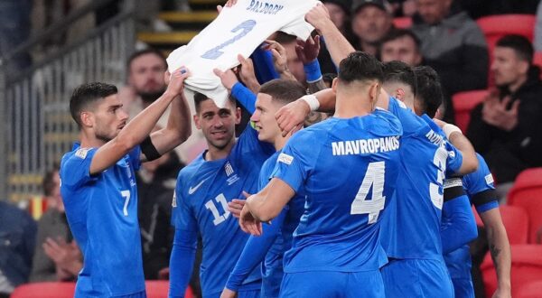 Greece players hold aloft a shirt in memory of George Baldock after Evangelos Pavlidis scores the opening goal of the game during the UEFA Nations League Group B2 match at Wembley Stadium, London. Picture date: Thursday October 10, 2024.,Image: 919225826, License: Rights-managed, Restrictions: Use subject to FA restrictions. Editorial use only. Commercial use only with prior written consent of the FA. No editing except cropping., Model Release: no, Credit line: John Walton / PA Images / Profimedia
