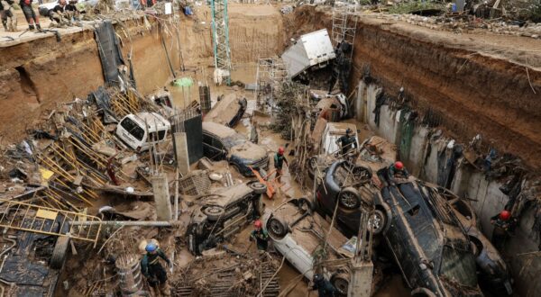 epa11696955 Civil Guard officers search for survivors inside cars trapped under the foundations of a building under construction in the town of Paiporta, Valencia, eastern Spain, 02 November 2024. According to the Integrated Operational Coordination Center (CECOPI), more than 200 people have died in Valencia and neighboring provinces after floods caused by a DANA (high-altitude isolated depression) weather phenomenon hit the east of the country. According to Spain's national weather agency (AEMET), on 29 October 2024 Valencia received a year's worth of rain, causing flash floods that destroyed homes and swept away vehicles.  EPA/Biel Alino