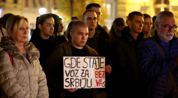 A man holds a banner that reads "Where does the train to Serbia stop without you." As people gather in front of Novi Sad city hall, following the roof of a train station collapsing, killing several people in Novi Sad, Serbia November 1, 2024. REUTERS/Zorana Jevtic Photo: ZORANA JEVTIC/REUTERS