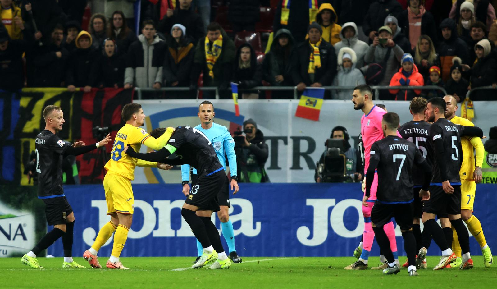 Soccer Football - Nations League - Group Stage - Romania v Kosovo - The National Arena, Bucharest, Romania - November 15, 2024 Romania's Razvan Marin clashes with Kosovo's Amir Rrahmani Inquam Photos via REUTERS/George Calin ROMANIA OUT. NO COMMERCIAL OR EDITORIAL SALES IN ROMANIA. THIS IMAGE HAS BEEN SUPPLIED BY A THIRD PARTY. Photo: GEORGE CALIN/REUTERS