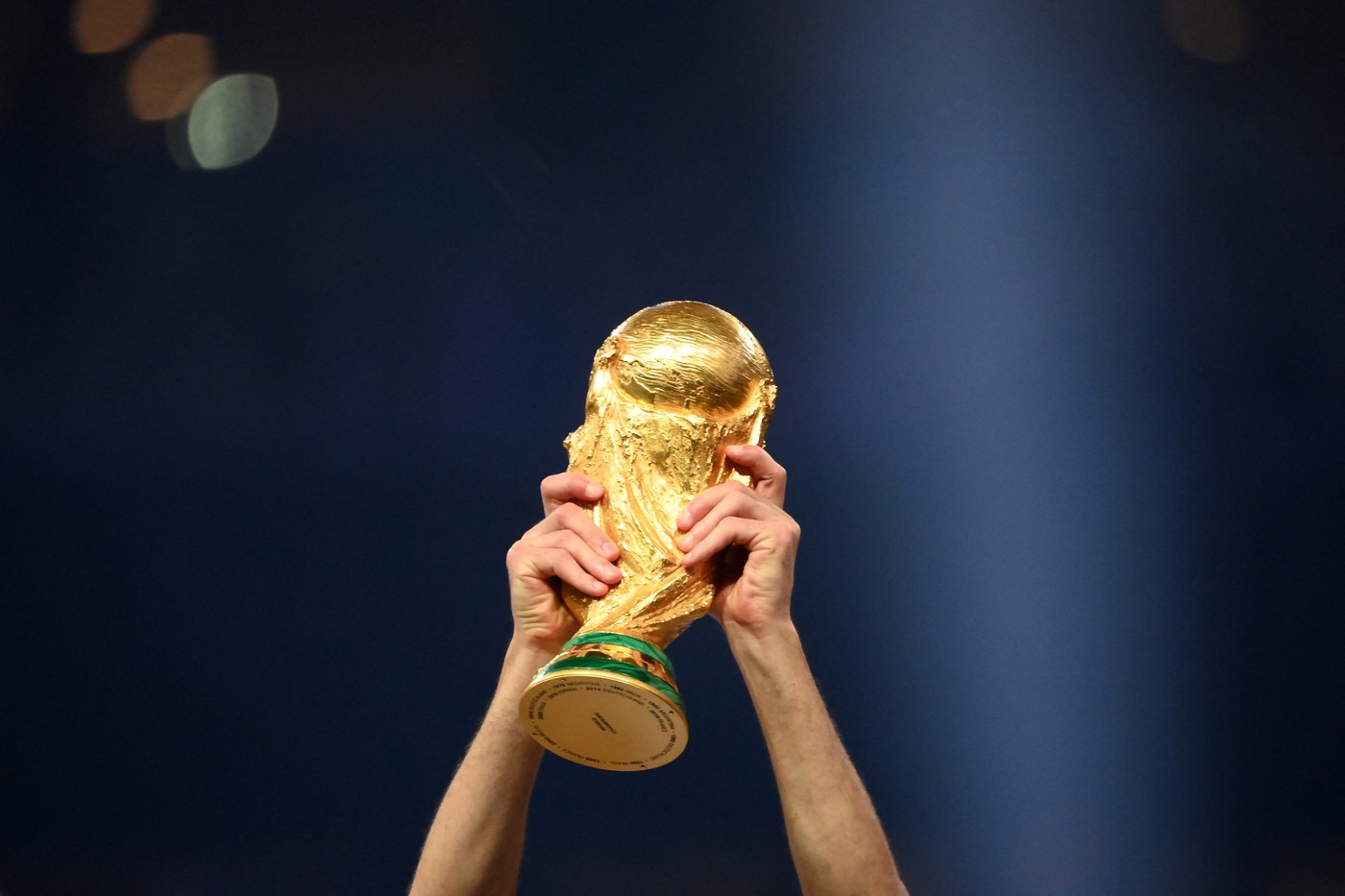 A player of Argentina lifts the World Cup trophy during the Qatar 2022 World Cup trophy ceremony after the football final match between Argentina and France at Lusail Stadium in Lusail, north of Doha on December 18, 2022. Argentina won in the penalty shoot-out.,Image: 745402290, License: Rights-managed, Restrictions: , Model Release: no, Credit line: FRANCK FIFE / AFP / Profimedia