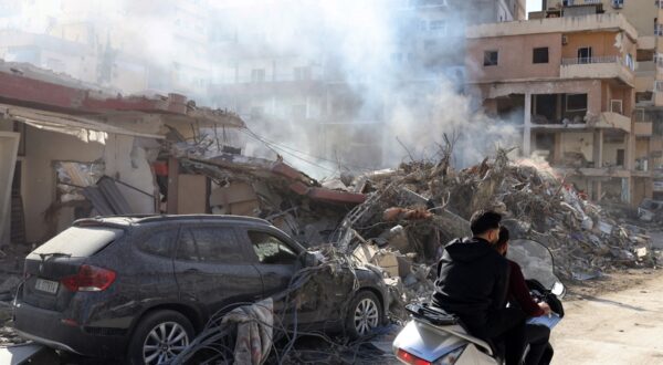 Residents ride a scooter amid destruction caused by Israeli bombing in the southern Lebanese city of Tyre on November 28, 2024, a day after a cease fire between Israel and Hezbollah took hold.  Since the ceasefire took effect on November 27, tens of thousands of Lebanese who fled their homes headed back to their towns and villages, only to find scenes of devastation.,Image: 940413177, License: Rights-managed, Restrictions: , Model Release: no, Credit line: Anwar AMRO / AFP / Profimedia
