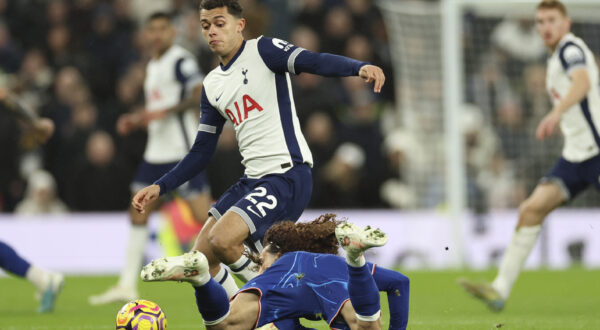 Tottenham's Brennan Johnson challenges for the ball with Chelsea's Marc Cucurella during the English Premier League soccer match between Tottenham Chelsea, at the Hotspur stadium in London, Sunday, Dec.8, 2024. (AP Photo/Ian Walton)