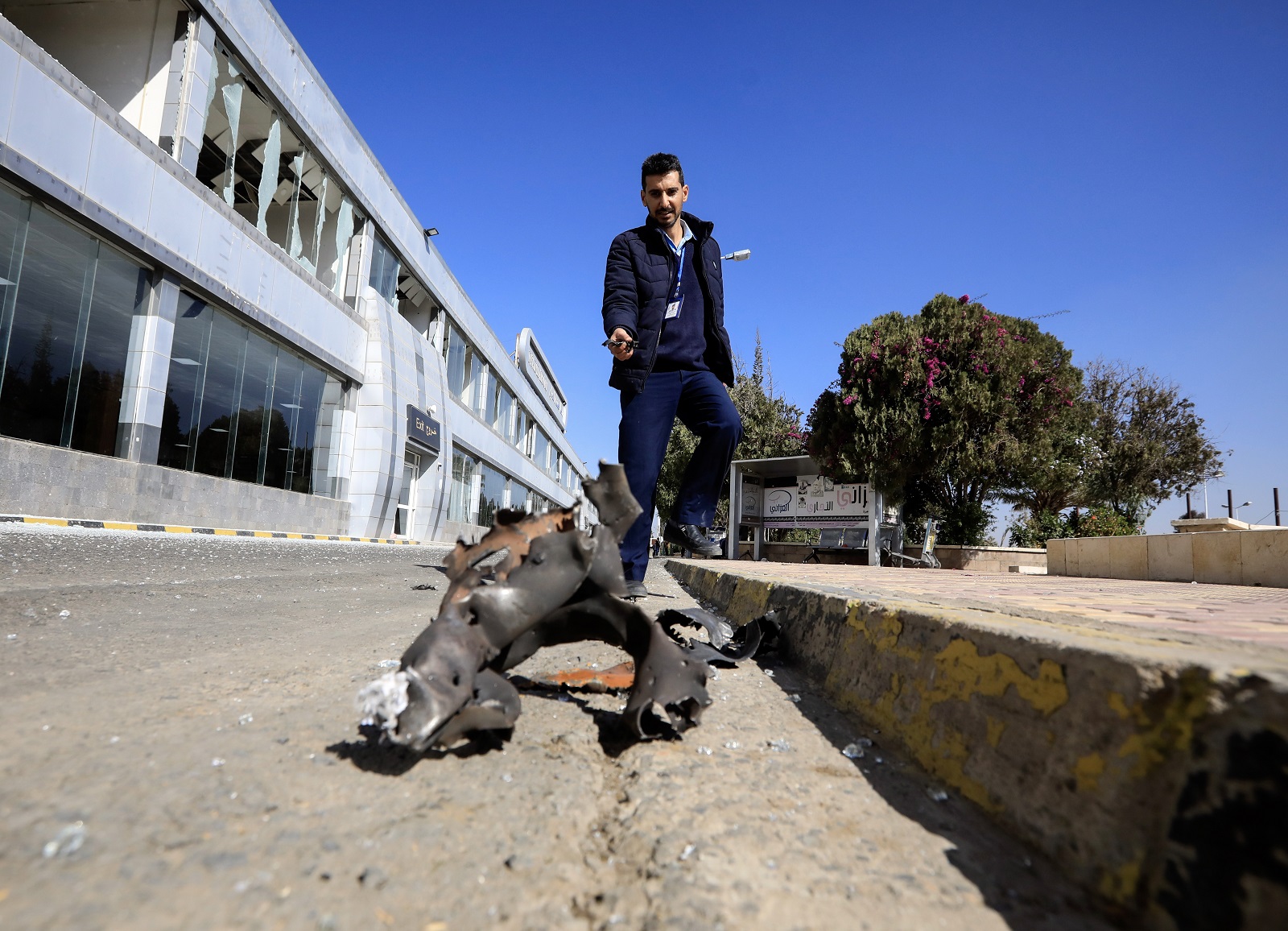 epa11794766 An airport staff inspects debris at Sana'a airport a day after Israeli airstrikes targeted the airport, in Sana'a, Yemen, 27 December 2024. At least six people were killed and 40 wounded across Yemen after Israeli airstrikes targeted on 26 December key facilities in Yemeni cities under the Houthis' control, including Sana'a International Airport, two power plants, military infrastructure and other sites in the ports of Hodeidah and Salif on Yemen's Red Sea coast, the Houthi-controlled Health Ministry reported.  EPA/YAHYA ARHAB