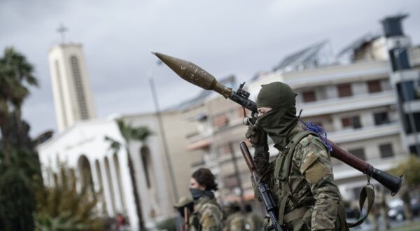 epa11794983 Syrian opposition fighters march during a military parade in Damascus, Syria, 27 December 2024. Members of Hay'at Tahrir al-Sham (HTS) began marching from abbasieen Square, passing through some of the Damascene neighborhoods, and arrived at Umayyad Square in a parade organized to send a message of strength and reassurance to the people, according to HTS.