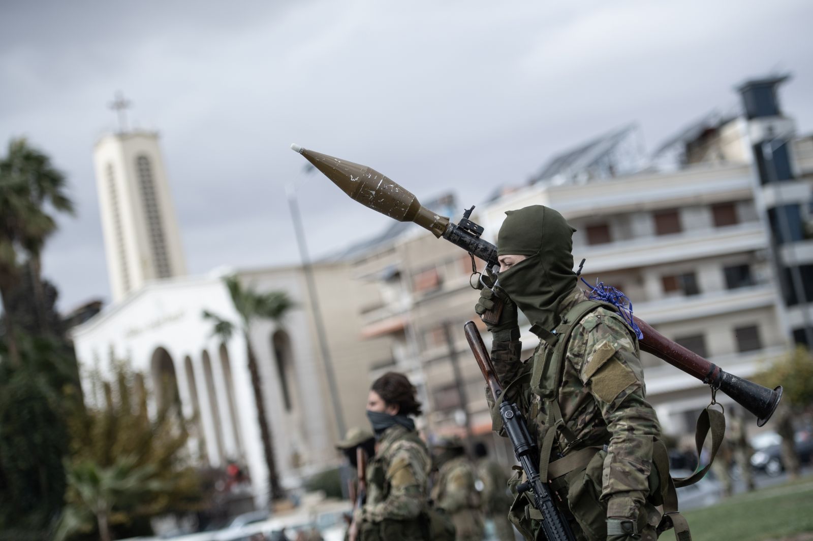 epa11794983 Syrian opposition fighters march during a military parade in Damascus, Syria, 27 December 2024. Members of Hay'at Tahrir al-Sham (HTS) began marching from abbasieen Square, passing through some of the Damascene neighborhoods, and arrived at Umayyad Square in a parade organized to send a message of strength and reassurance to the people, according to HTS.