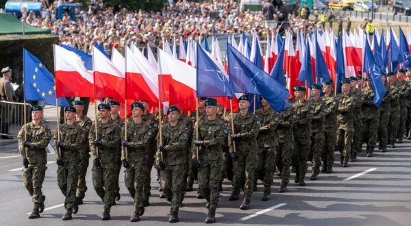 August 15, 2024, Warsaw, Poland: Servicemen of the Polish Army march with Polish and NATO flags at Wislostrada in the centre of Warsaw, the capital Poland as crowds gather to watch the military parade on Polish Army Day. Poland's armed forces, along with allied troops stationed in the country, participated in a parade in front of the public, the media, and assembled dignitaries. Before the parade, Poland's Deputy Prime Minister and Minister of National Defence, Wladyslaw Kosiniak-Kamysz, Poland's Prime Minister, Donald Tusk, and Poland's President, Andrzej Duda addressed the public and the assembled media. The parade featured soldiers, mechanized divisions, tanks, various armoured vehicles, and a fly-over by members of Poland's Air Force.,Image: 899268424, License: Rights-managed, Restrictions: , Model Release: no, Credit line: Marek Antoni Iwanczuk / Zuma Press / Profimedia