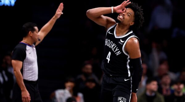 Brooklyn Nets guard Dennis Smith Jr. (4) reacts after making a 3-point shot during the second half of an NBA basketball game against the San Antonio Spurs, Saturday, Feb. 10, 2024, in New York. (AP Photo/Noah K. Murray) Spurs Nets Basketball