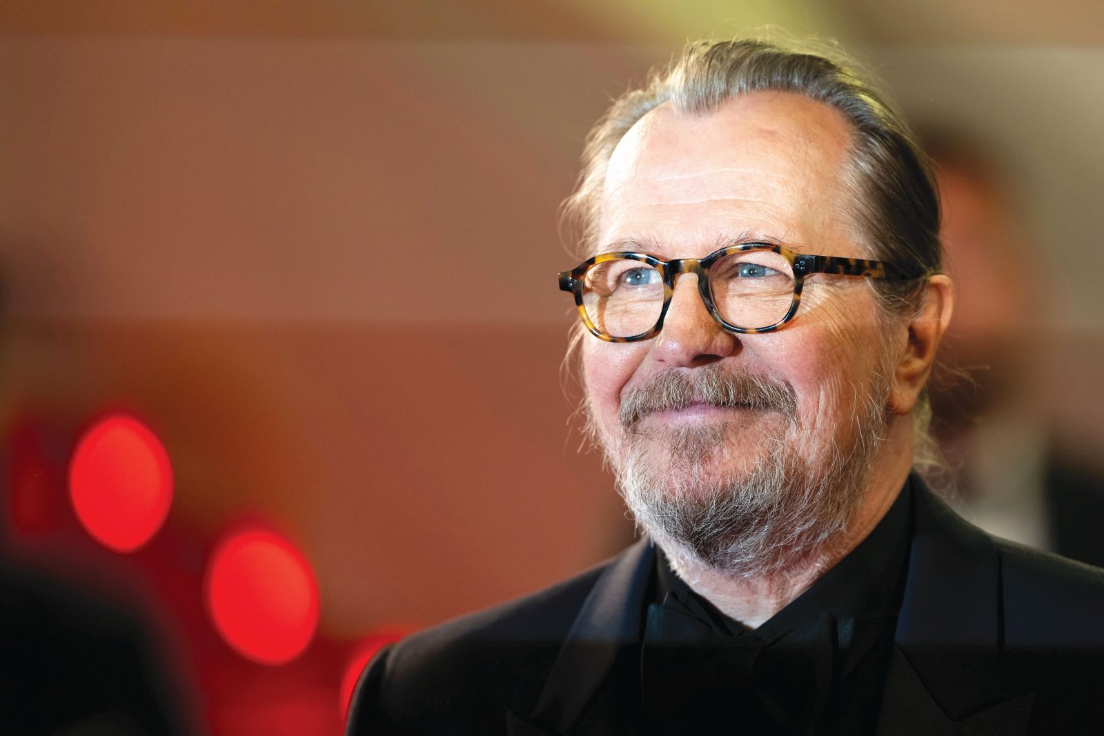 Gary Oldman poses for photographers upon arrival at the premiere of the film 'Parthenope' at the 77th international film festival, Cannes, southern France, Tuesday, May 21, 2024. (Photo by Scott A Garfitt/Invision/AP)