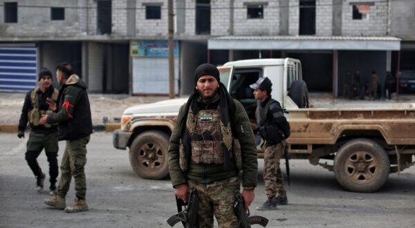 epa11805847 Syrian opposition fighters secure the area near Manbij city, northern Syria, 04 January 2025. A group of opposition fighters from the National Army gathered near Manbij to launch a military operation against the positions of the Syrian Democratic Forces (SDF) in Tishreen Dam near the city of Manbij in northern Syria.  EPA/BILAL AL HAMMOUD