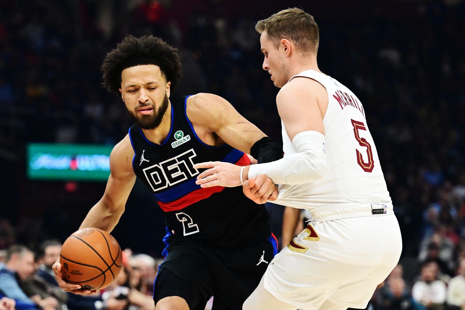 Jan 27, 2025; Cleveland, Ohio, USA; Detroit Pistons guard Cade Cunningham (2) drives to the basket against Cleveland Cavaliers guard Sam Merrill (5) during the first half at Rocket Mortgage FieldHouse. Mandatory Credit: Ken Blaze-Imagn Images Photo: Ken Blaze/REUTERS