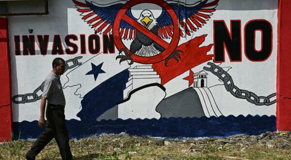 A man walks past a mural that reads 'No to invasion' in Colon, Panama on January 29, 2025. Panama's President Jose Raul Mulino ruled out any negotiations with the US over the Panama Canal, on the eve of a visit by US Secretary of State Marco Rubio.,Image: 958945073, License: Rights-managed, Restrictions: , Model Release: no, Credit line: MARTIN BERNETTI / AFP / Profimedia
