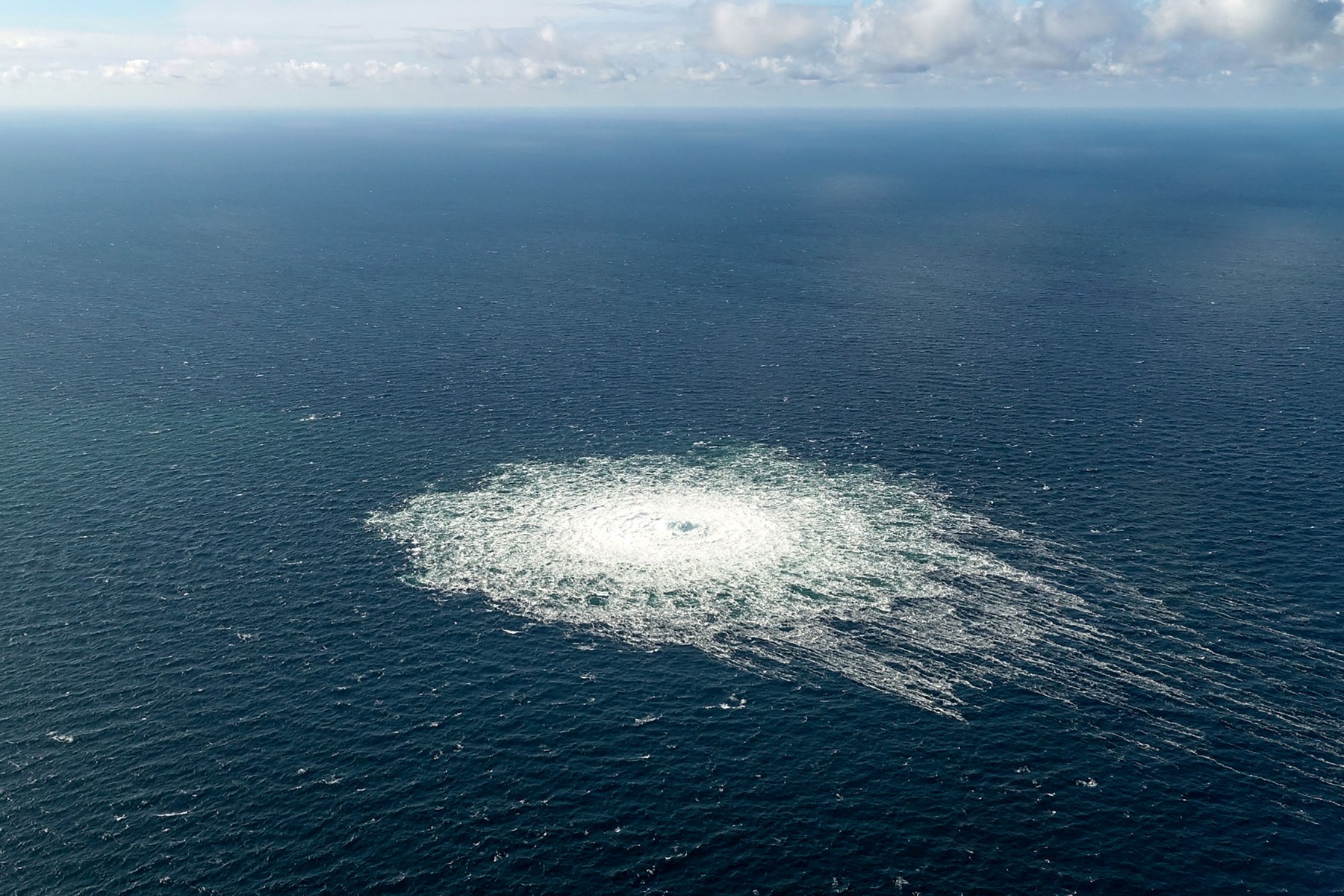 This handout picture released on September 27, 2022 by the Danish Defence Command shows the gas leak at the Nord Stream 2 gas pipeline as it is seen from the Danish Defence's F-16 rejection response off the Danish Baltic island of Bornholm, south of Dueodde.  The two Nord Stream gas pipelines linking Russia and Europe have been hit by unexplained leaks, Scandinavian authorities said on September 27, 2022, raising suspicions of sabotage. The pipelines have been at the centre of geopolitical tensions in recent months as Russia cut gas supplies to Europe in suspected retaliation against Western sanctions following its invasion of Ukraine.,Image: 726456120, License: Rights-managed, Restrictions: RESTRICTED TO EDITORIAL USE - MANDATORY CREDIT "AFP PHOTO /  DANISH DEFENCE " - NO MARKETING - NO ADVERTISING CAMPAIGNS - DISTRIBUTED AS A SERVICE TO CLIENTS - LARGER VERSION, ***
HANDOUT image or SOCIAL MEDIA IMAGE or FILMSTILL for EDITORIAL USE ONLY! * Please note: Fees charged by Profimedia are for the Profimedia's services only, and do not, nor are they intended to, convey to the user any ownership of Copyright or License in the material. Profimedia does not claim any ownership including but not limited to Copyright or License in the attached material. By publishing this material you (the user) expressly agree to indemnify and to hold Profimedia and its directors, shareholders and employees harmless from any loss, claims, damages, demands, expenses (including legal fees), or any causes of action or allegation against Profimedia arising out of or connected in any way with publication of the material. Profimedia does not claim any copyright or license in the attached materials. Any downloading fees charged by Profimedia are for Profimedia's services only. * Handling Fee Only 
***, Model Release: no, Credit line: Handout / AFP / Profimedia