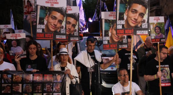 Relatives and supporters of Israeli hostages taken by Palestinian militants on the October 7 Hamas attack and held in Gaza, hold images of their loved ones during a protest calling for their release in front of Prime Minister Benjamin Netanyahu residency in Jerusalem on October 7, 2024.,Image: 917496529, License: Rights-managed, Restrictions: , Model Release: no, Credit line: Menahem KAHANA / AFP / Profimedia