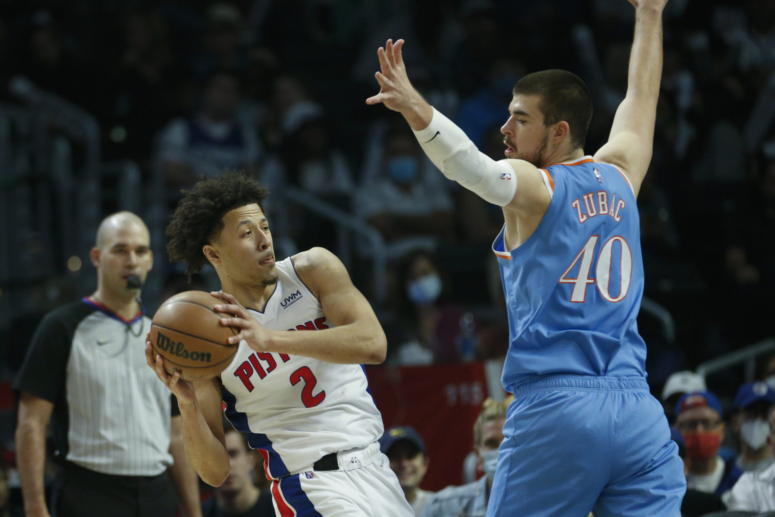 Detroit Pistons guard Cade Cunningham (2) is defended by Los Angeles Clippers center Ivica Zubac (40) during the second half of an NBA basketball game, Friday, Nov. 26, 2021, in Los Angeles. The Clippers won 107-96. (AP Photo/Ringo H.W. Chiu)
