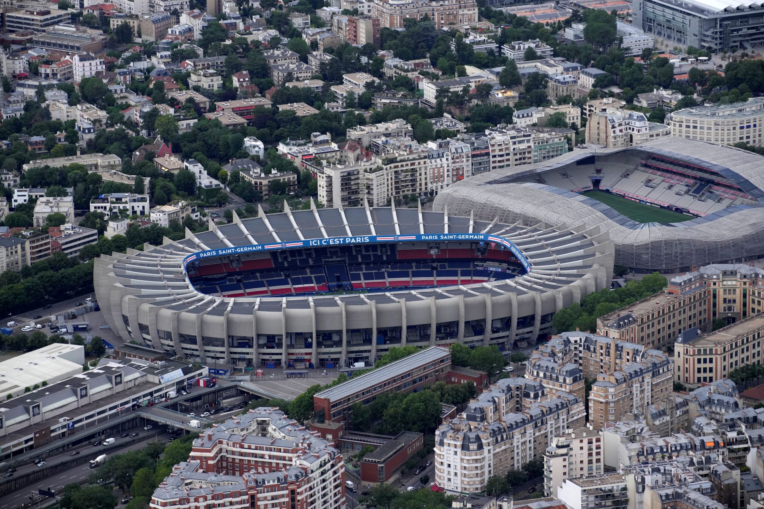 The Parc des Princes stadium is seen in Paris, France, Tuesday, July 11, 2023. The stadium will host the Paris 2024 men and women's soccer competitions. At right is the Jean Bouin stadium. (AP Photo/Christophe Ena) Paris 2024 Olympics