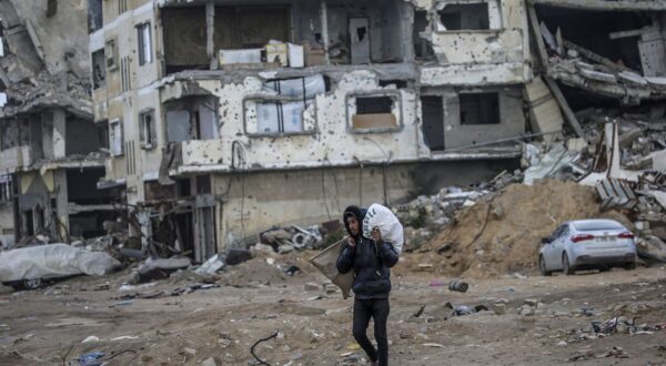 epa11878858 A Palestinian man walks past destroyed buildings in the streets of Gaza City amid a ceasefire between Israel and Hamas, Gaza Strip, 06 February 2025. Israel and Hamas implemented the first phase of a hostage release and ceasefire deal on 19 January 2025. More than 46,000 Palestinians have been killed in the Gaza Strip, according to the Palestinian Ministry of Health, since Israel launched a military campaign in the strip in response to a cross-border attack led by the Palestinian militant group Hamas on 07 October 2023, in which about 1,200 Israelis were killed and more than 250 taken hostage.  EPA/MOHAMMED SABER