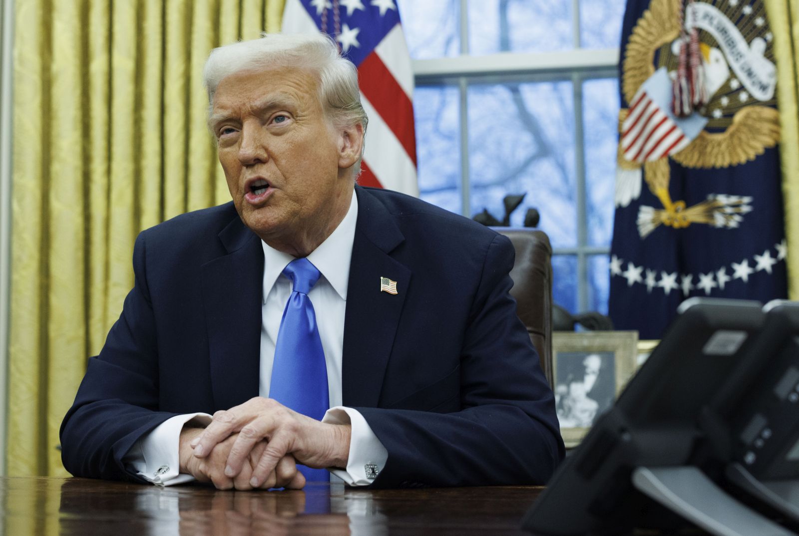 epa11889325 US President Donald J. Trump (R) gives remarks to the media in the Oval Office of the White House, as he meets with US entrepreneur and U.S. special government employee Elon Musk (L), in Washington, DC, USA, 11 February 2025.  EPA/Aaron Schwartz / POOL