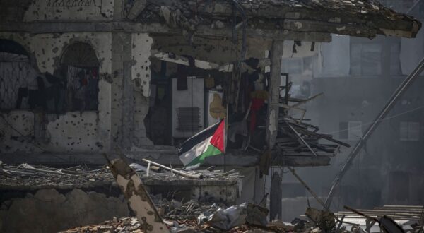 epa11902820 A Palestinian flag flies next to the shelter of a Palestinain family set up among the rubble of destroyed buildings amid a ceasefire between Israel and Hamas, in Jabalya refugee camp, northern Gaza Strip, 17 February 2025. Israel and Hamas implemented the first phase of a hostage release and ceasefire deal on 19 January 2025. More than 46,000 Palestinians have been killed in the Gaza Strip, according to the Palestinian Ministry of Health, since Israel launched a military campaign in the strip in response to a cross-border attack led by the Palestinian militant group Hamas on 07 October 2023, in which about 1,200 Israelis were killed and more than 250 taken hostage.  EPA/MOHAMMED SABER