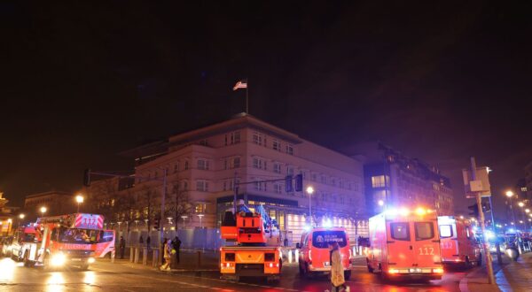 epa11913779 Ambulances park in front of the US Embassy and near a crime scene at the Holocaust Memorial in Berlin, Germany, 21 February 2025. On Friday evening at around 6pm, a man was seriously injured. The police cordoned off a large area. Officers are searching the memorial grounds. According to the police, the man was injured by a sharp object and was taken to hospital by the fire brigade's ambulance service.  EPA/CHRISTOPHER NEUNDORF