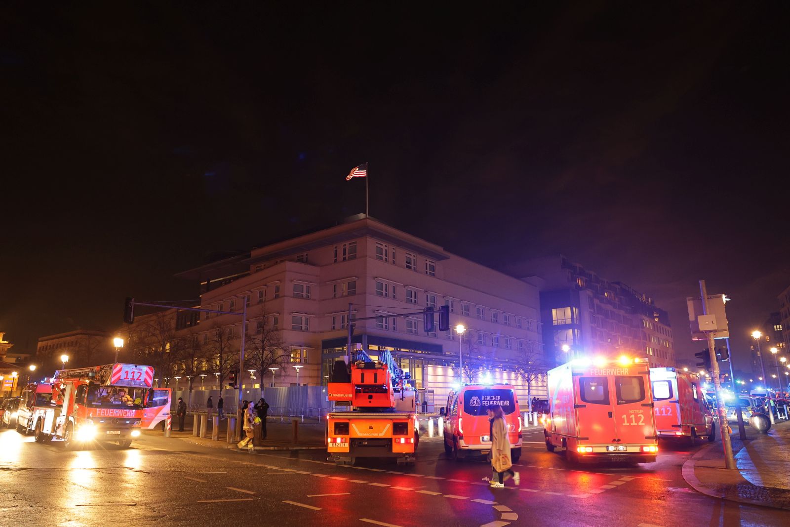 epa11913779 Ambulances park in front of the US Embassy and near a crime scene at the Holocaust Memorial in Berlin, Germany, 21 February 2025. On Friday evening at around 6pm, a man was seriously injured. The police cordoned off a large area. Officers are searching the memorial grounds. According to the police, the man was injured by a sharp object and was taken to hospital by the fire brigade's ambulance service.  EPA/CHRISTOPHER NEUNDORF